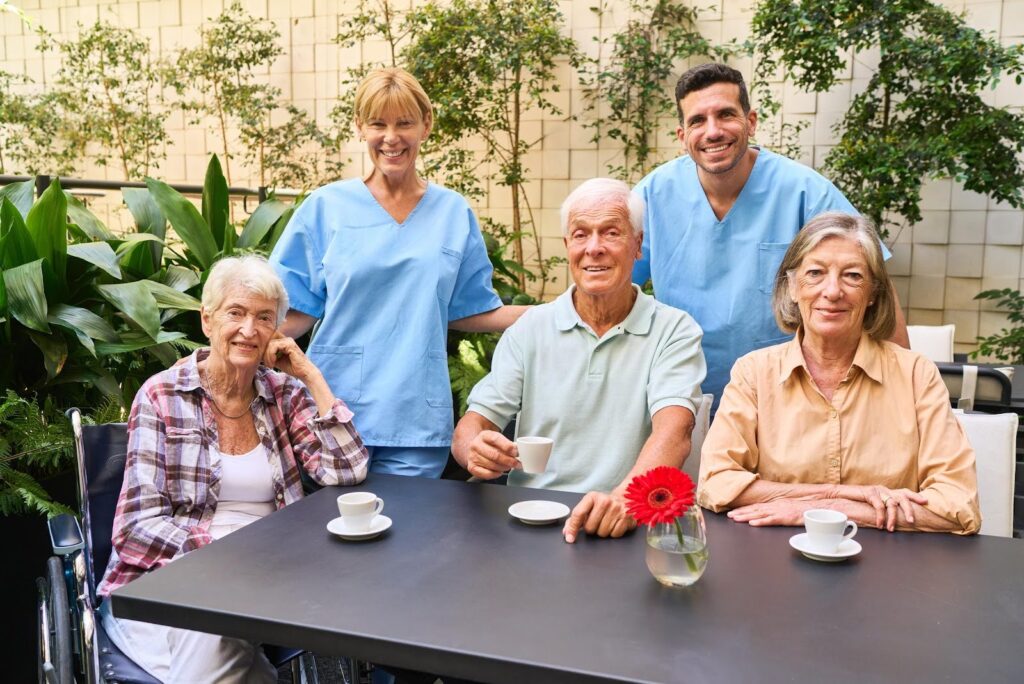 CTK Advisors guiding an Adult Day Program team through a DHS site visit preparation, with caregivers and seniors gathered in a compliant, welcoming care environment.