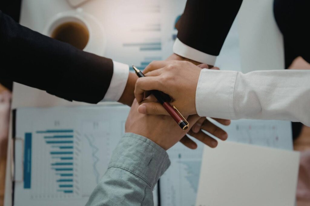 CTK Advisors guiding providers through the CILA provider agreement process, showing professionals collaborating over documents during a step-by-step application review.