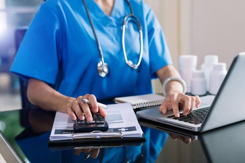 Healthcare licensing documents being reviewed before application submission, highlighting how CTK Advisors helps providers prevent early licensing and compliance problems.