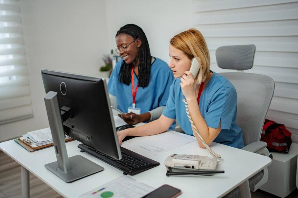 Healthcare administrative team managing recurring tasks with backup processes to maintain consistent operations and compliance, with guidance from CTK Advisors.