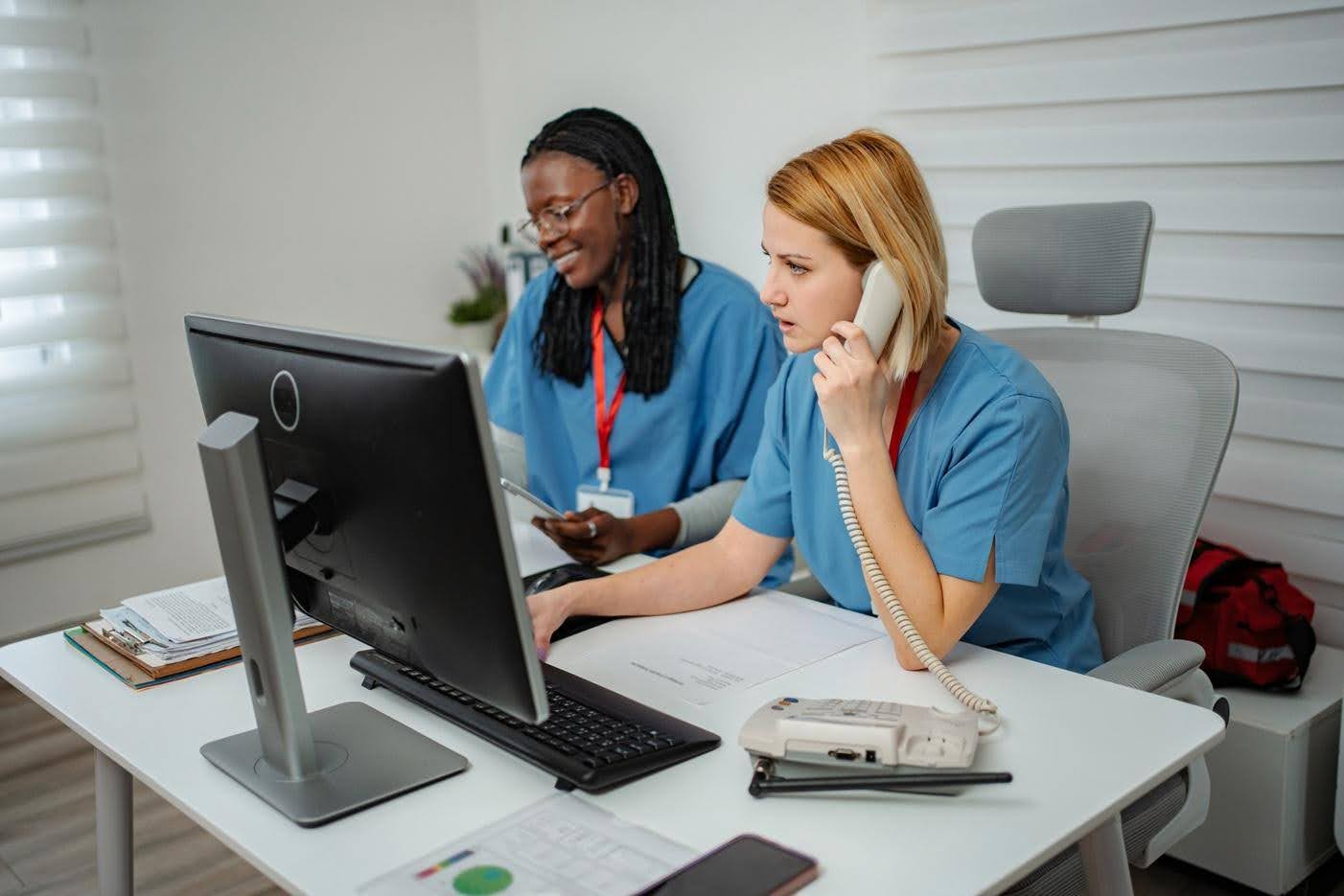 Healthcare administrative team managing recurring tasks with backup processes to maintain consistent operations and compliance, with guidance from CTK Advisors.