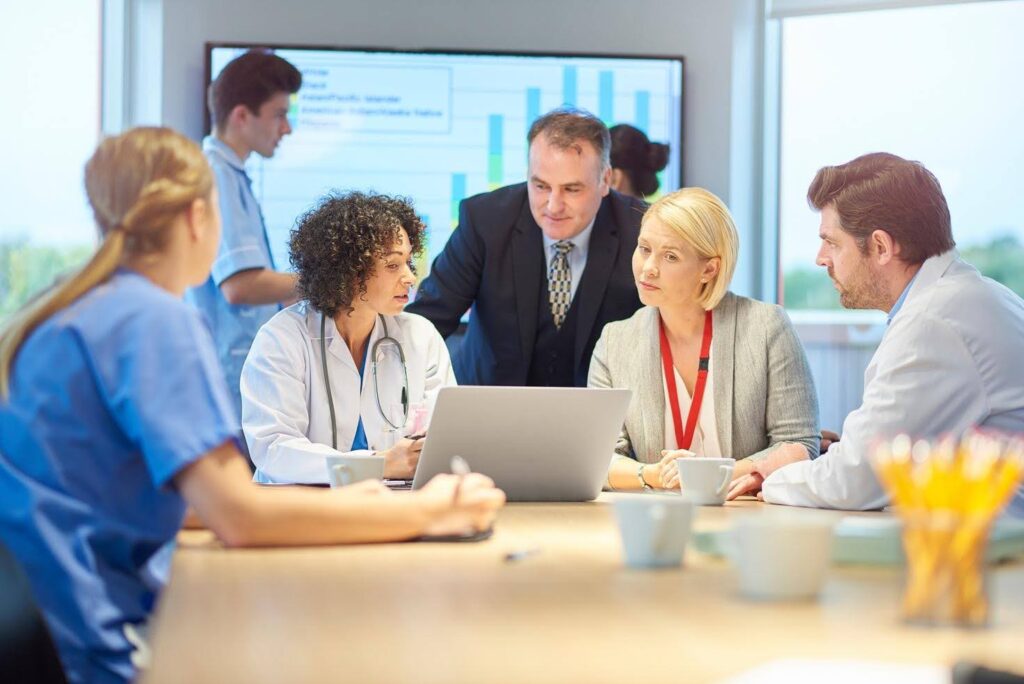Healthcare business owner managing operations and administrative responsibilities, highlighting how CTK Advisors helps professionals transition from working in healthcare to owning a healthcare business.
