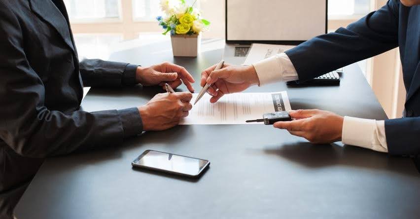 Business professionals reviewing a lease agreement before signing for a healthcare business, highlighting planning and compliance guidance from CTK Advisors.