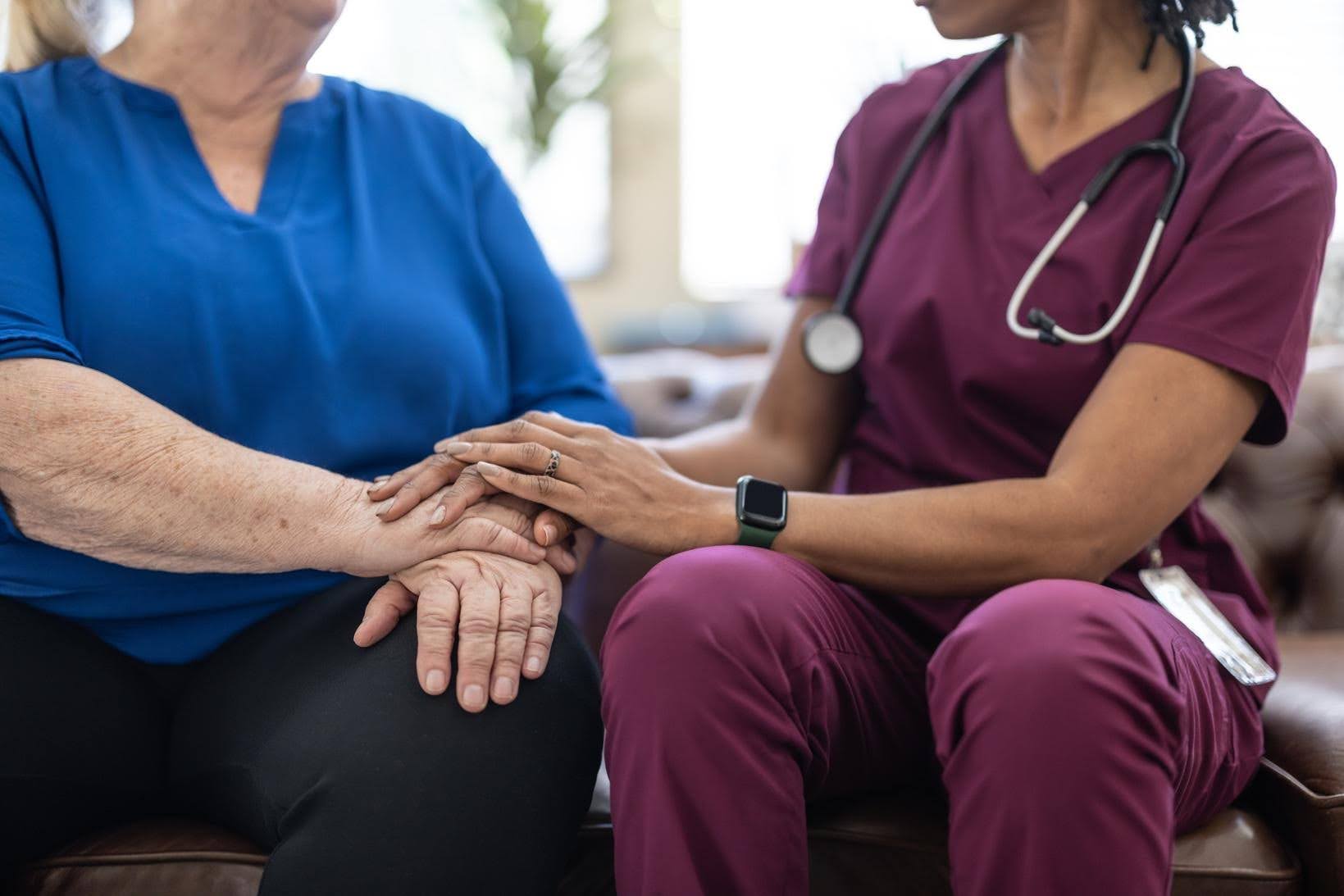 Healthcare professional supporting an older client whose care needs have increased beyond the agency’s initial plan.